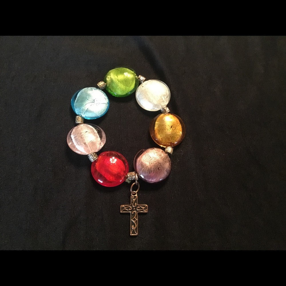 Multi color glass bead bracelet w/ a bronze cross